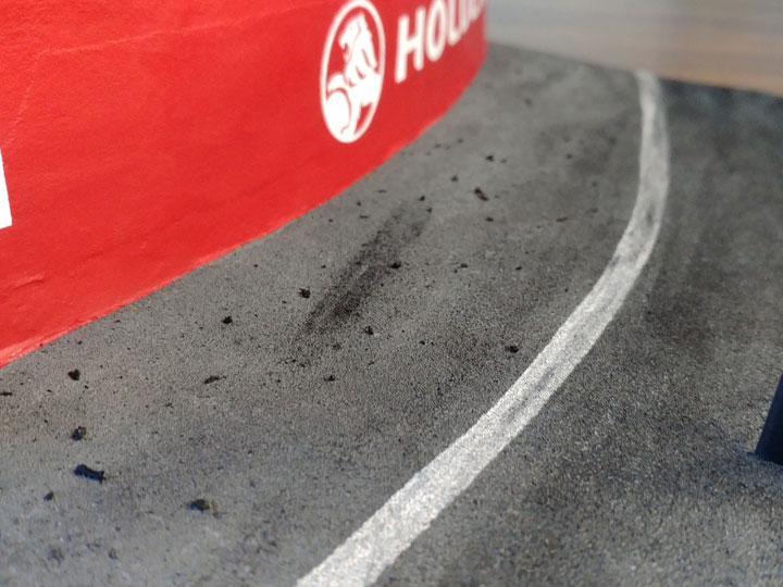Debris on the edge of a racetrack diorama