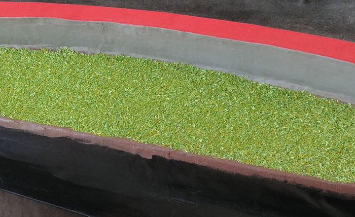 Glueing the scatter material on the race track diorama