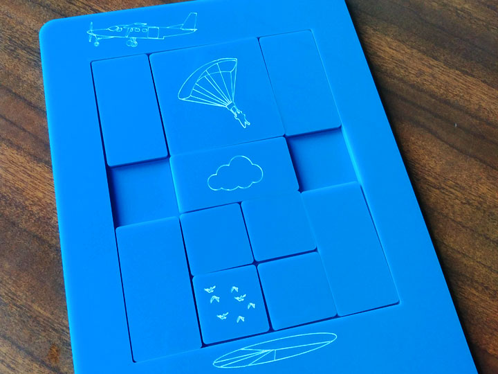 A close up of the engravings of the skydiver parachuting to the ground