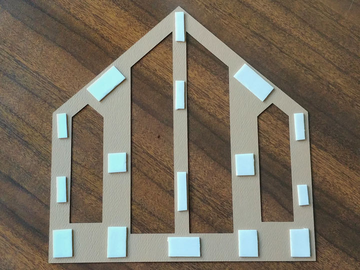 Adding foam double sided tape to the back of the chapel wall