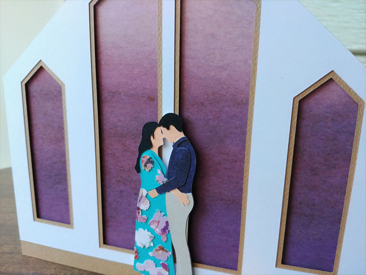 Paper craft card of a couple at their wedding